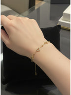 İçi Boş Kalp Üstü Taşlı Gold Renk Paslanmaz Çelik Kadın Bileklik - Sevgiliye Hediye